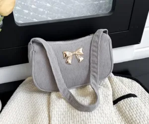 uc-326.webp CARTERA TEXTURA PANA GRIS CON LAZO ANCHO